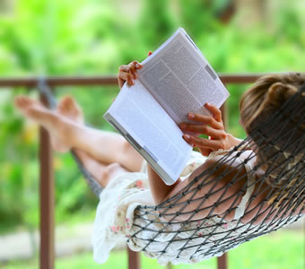 Woman reading in a hammock