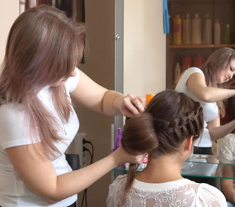 Woman having her hair styled