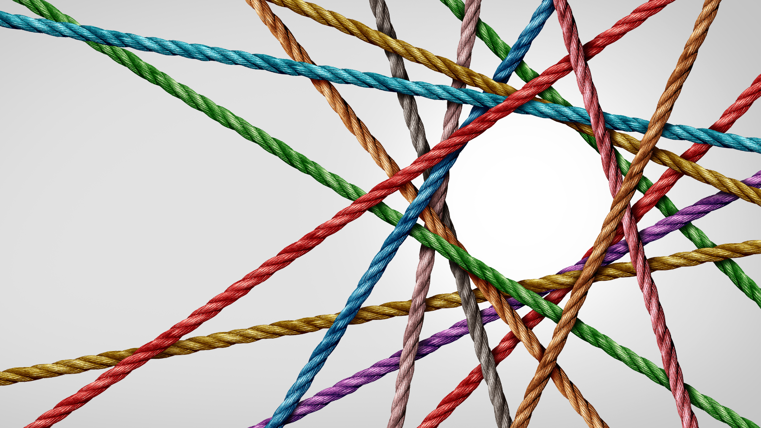 colored string making a circle as a negative shape